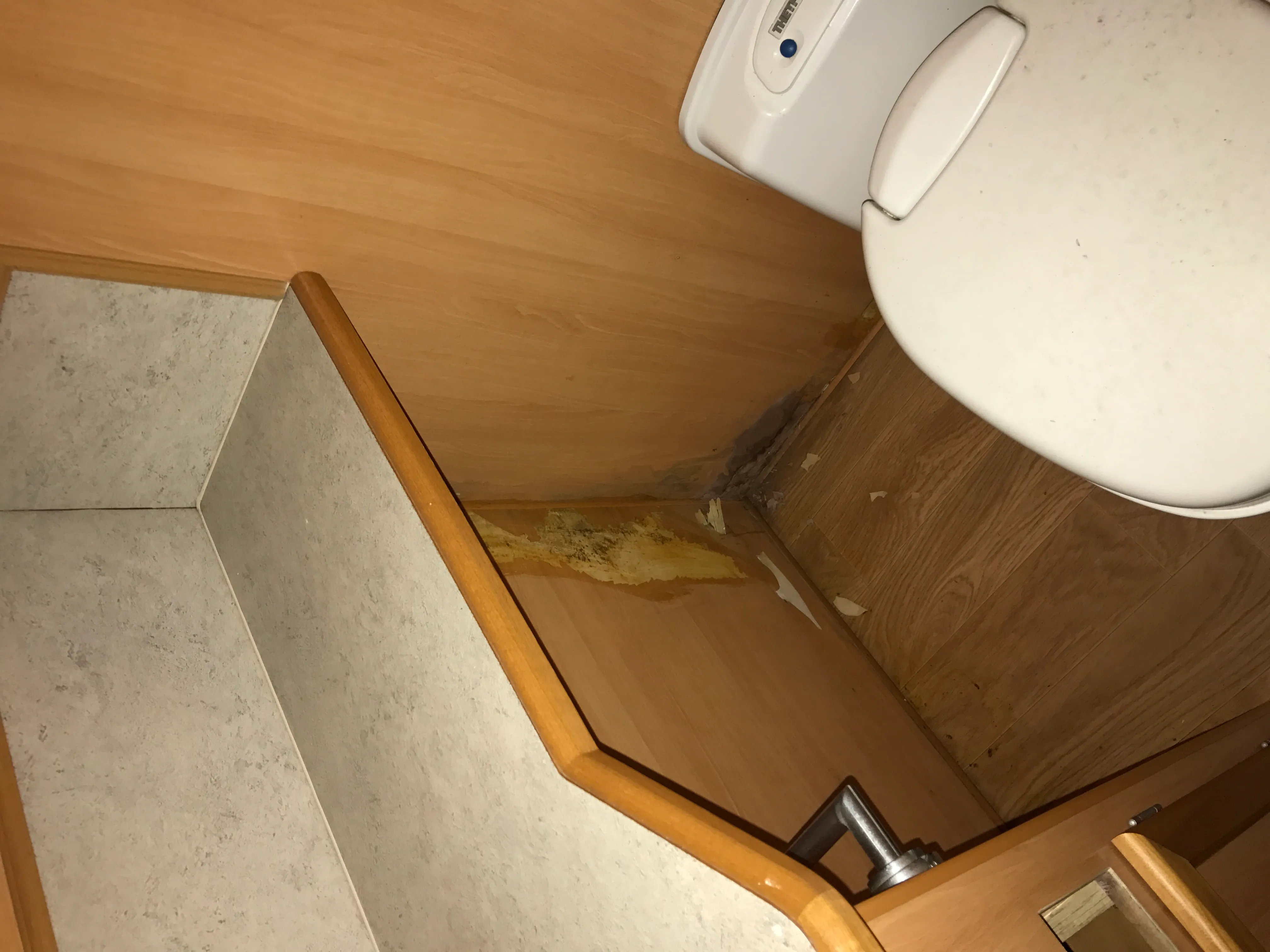 caravan bathroom water damage corner